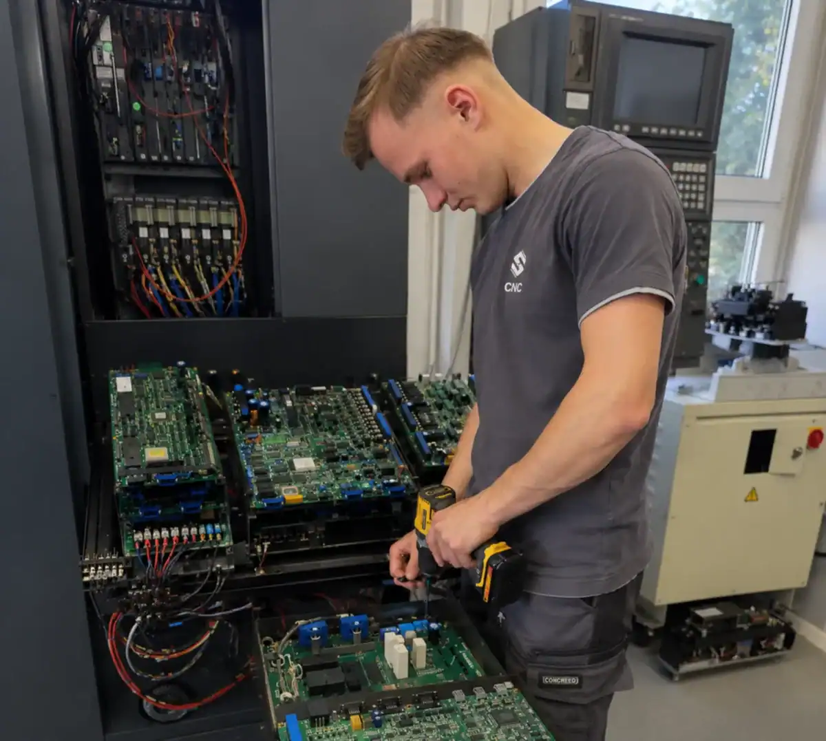 Okuma CNC control board repair and electronics testing in workshop